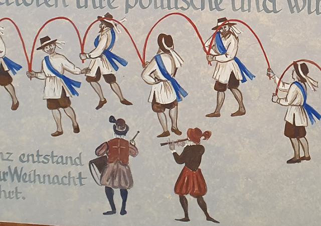 Wandbild mit der Dartstellung des Böttchertanzes.
